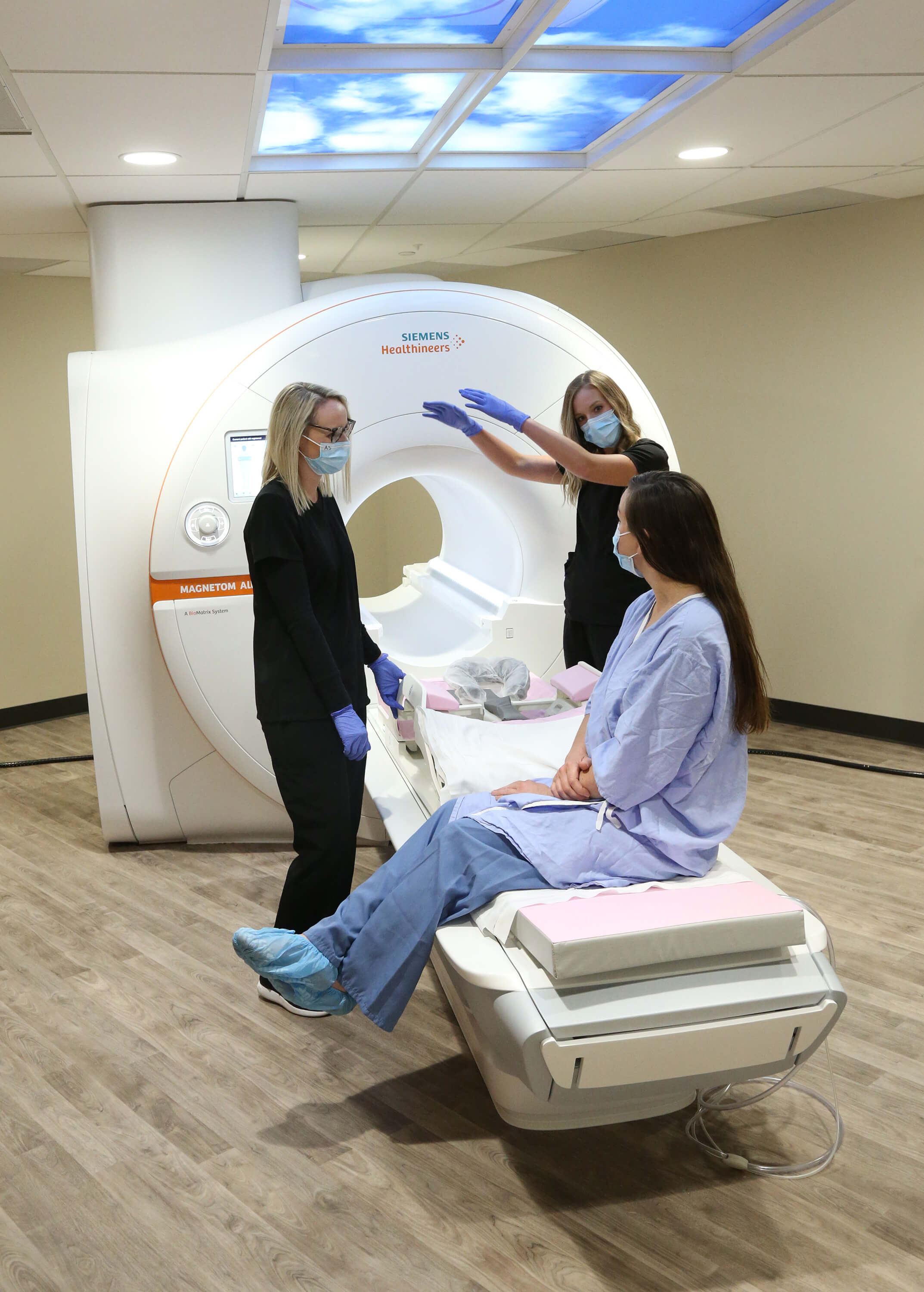 nurses-prepping-MRI-machine-and-patient